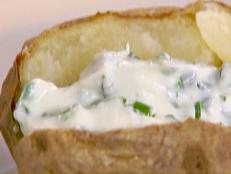Cooking Channel serves up this Baked Potatoes with Creamy Herb Topping recipe from Ellie Krieger plus many other recipes at CookingChannelTV.com