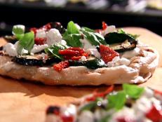 Cooking Channel serves up this Grilled Zucchini and Herb Pizza recipe from Aida Mollenkamp plus many other recipes at CookingChannelTV.com