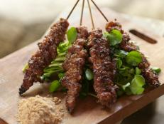 Cooking Channel serves up this Char Grilled Hmong Black Pig Skewers with Sesame Salt: Thit Lon Nuong Muoi Vung recipe from Luke Nguyen plus many other recipes at CookingChannelTV.com