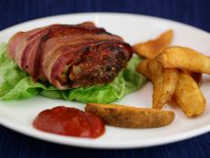 Cooking Channel serves up this Bacon-Wrapped Meatloaf Burgers recipe  plus many other recipes at CookingChannelTV.com