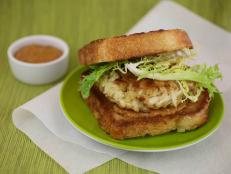 Cooking Channel serves up this Crab Burgers with Frisee Salad recipe  plus many other recipes at CookingChannelTV.com