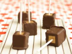 Cooking Channel serves up this Chocolate Covered Peanut Butter Cheesecake Pops recipe  plus many other recipes at CookingChannelTV.com