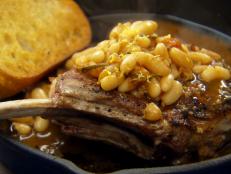 Cooking Channel serves up this Veal Chops with Stewed Tomatoes and White Beans recipe from Chuck Hughes plus many other recipes at CookingChannelTV.com