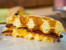 Cooking Channel serves up this Cheddar and Bacon Cornmeal Waffle Sandwiches with Maple Mustard recipe from Bobby Flay plus many other recipes at CookingChannelTV.com