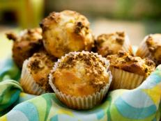 Cooking Channel serves up this Yogurt-Fruit Muffins with Bran Crumb Topping recipe from Bobby Flay plus many other recipes at CookingChannelTV.com