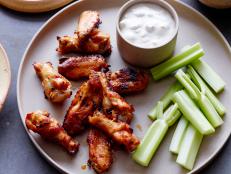 Cooking Channel serves up this Buffalo Wings with Blue Cheese Dipping Sauce recipe from Kelsey Nixon plus many other recipes at CookingChannelTV.com