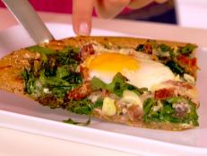 Cooking Channel serves up this Egg, Ham and Spinach Pizza recipe from Ellie Krieger plus many other recipes at CookingChannelTV.com