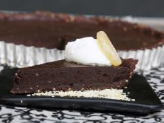Cooking Channel serves up this Toasted Sesame and Candied Ginger Chocolate Truffle Tart recipe  plus many other recipes at CookingChannelTV.com