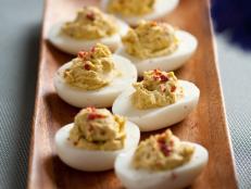 Cooking Channel serves up this 4-Pepper Deviled Eggs recipe from Alton Brown plus many other recipes at CookingChannelTV.com