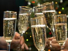 People hands with crystal glasses full of champagne