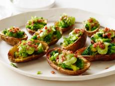 Cooking Channel serves up this Broccoli and Cheddar-Stuffed Potato Skins with Avocado Cream recipe from Ellie Krieger plus many other recipes at CookingChannelTV.com
