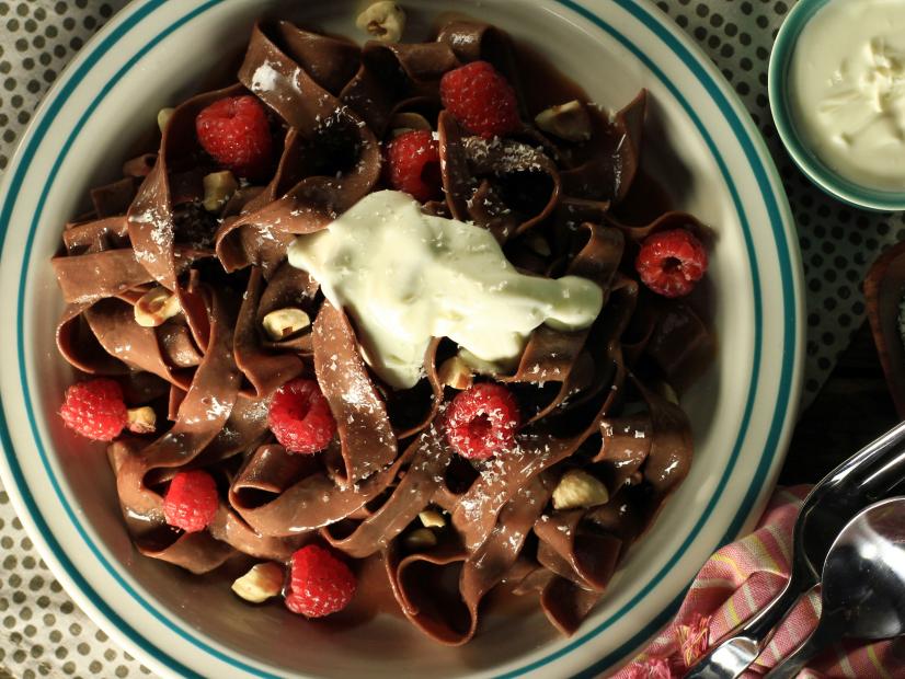 chocolate pasta with chocolate hazelnut cream sauce, white chocolate shavings and fresh berries, see more at //homemaderecipes.com/cooking-101/11-unique-pasta-recipes/ 