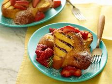 Cooking Channel serves up this Grilled French Toast with Strawberries and Rosemary recipe from Michael Symon plus many other recipes at CookingChannelTV.com