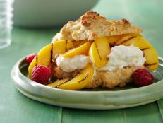 Cooking Channel serves up this Shortcakes with Grilled Peaches, Sweet Ricotta Cream, Truffled Honey and Huckleberries recipe from Lynn Crawford plus many other recipes at CookingChannelTV.com