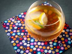 Cooking Channel serves up this Bourbon Tea Punch with Citrus Ice Cubes recipe  plus many other recipes at CookingChannelTV.com