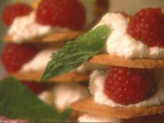 Cooking Channel serves up this Lace Cookies with Orange-Mascarpone Filling and Raspberries recipe  plus many other recipes at CookingChannelTV.com