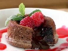Cooking Channel serves up this Molten Chocolate Cakes with Raspberry Sauce recipe from Brian Boitano plus many other recipes at CookingChannelTV.com