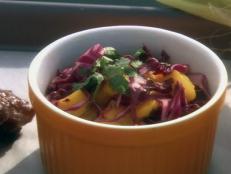 Cooking Channel serves up this Mango and Red Cabbage Slaw recipe from Ingrid Hoffmann plus many other recipes at CookingChannelTV.com