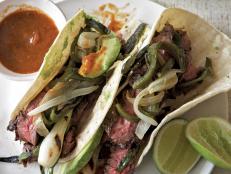 Cooking Channel serves up this Grilled Garlic-Marinated Skirt Steak Tacos recipe  plus many other recipes at CookingChannelTV.com