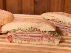 Cooking Channel serves up this Muffaletta recipe from Bobby Flay plus many other recipes at CookingChannelTV.com