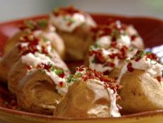 Cooking Channel serves up this Mini Baked Potatoes with Mascarpone and Prosciutto Bits recipe from Michael Chiarello plus many other recipes at CookingChannelTV.com