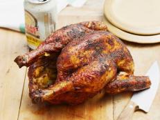 Cooking Channel serves up this Beer Can Chicken recipe from Bobby Flay plus many other recipes at CookingChannelTV.com