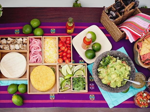Throw a summery "Fiesta" party with margaritas, taco bar and colorful piñata.