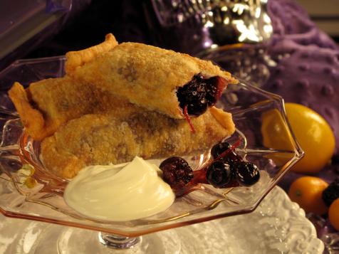 Black and Blueberry Dumplings with Vanilla Ice Cream and Chocolate Sauce