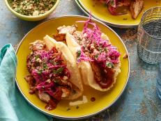 Cooking Channel serves up this Yucatan Chicken Puffy Tacos with Peanut-Red Chili BBQ Sauce and Red Cabbage Slaw recipe from Bobby Flay plus many other recipes at CookingChannelTV.com
