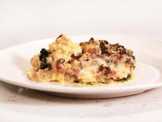 Cooking Channel serves up this The Ultimate Breakfast for Dinner: Sausage and Spinach Egg Strata recipe from Rachael Ray plus many other recipes at CookingChannelTV.com