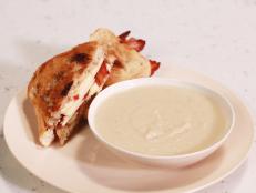 Cooking Channel serves up this Creamy Apple and Celery Root Soup with Grilled Cheddar, Bacon and Apple Honey Mustard Sandwich recipe from Rachael Ray plus many other recipes at CookingChannelTV.com