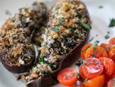 Cooking Channel serves up this Stuffed Eggplant with Veal and Spinach recipe from Rachael Ray plus many other recipes at CookingChannelTV.com