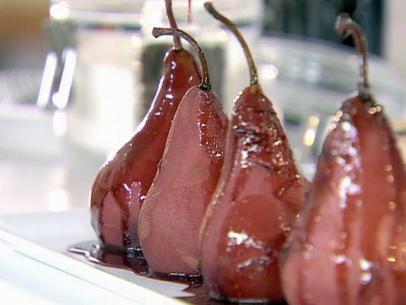 Frame 884
Ellie Krieger's peeled pears are boiled then covered in red wine syrup. Served on Healthy Appetite as a light fruity dessert.   
