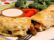 Cooking Channel serves up this Chicken and Black Bean Enchiladas with Gooey Jack Cheese recipe from Robin Miller plus many other recipes at CookingChannelTV.com