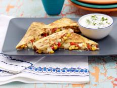Cooking Channel serves up this Southwest Quesadilla with Cilantro-Lime Sour Cream recipe from Sunny Anderson plus many other recipes at CookingChannelTV.com
