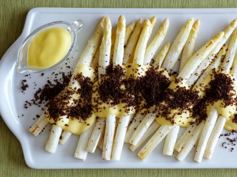 Roasted White Asparagus with Sauerkraut Hollandaise and Toasted Pumpernickel Breadcrumbs