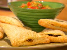 Cooking Channel serves up this Chicken and Bean Puff Pastry Empanadas recipe from Dave Lieberman plus many other recipes at CookingChannelTV.com