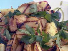 Cooking Channel serves up this Grilled Yukon Gold Potatoes with Rosemary-Lemon-Garlic Vinaigrette recipe from Bobby Flay plus many other recipes at CookingChannelTV.com
