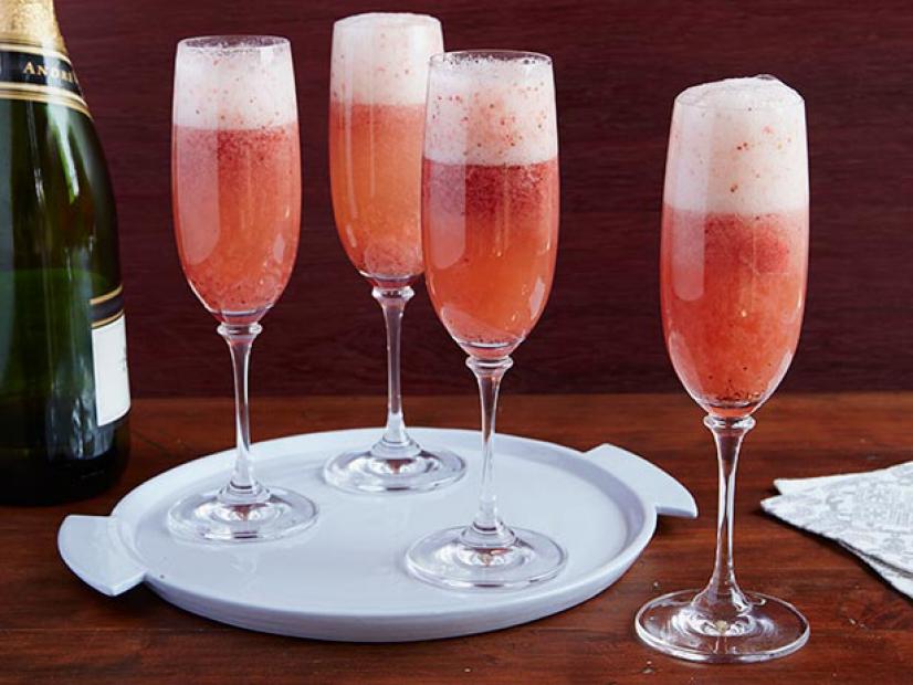 Frame 1041
Bobby Flay's Grand Champagne Cocktail is made of orange-flavored liqueur, honey and strawberries. 