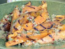 Cooking Channel serves up this Garlic and Herb Grilled Sweet Potato Fries recipe from Bobby Flay plus many other recipes at CookingChannelTV.com