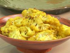 Cooking Channel serves up this Oven Roasted Cauliflower with Turmeric and Ginger recipe from Bobby Flay plus many other recipes at CookingChannelTV.com