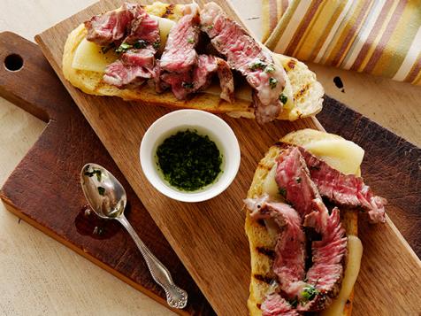 Mini Open Faced Steak Sandwiches on Garlic Bread with Aged Provolone and Parsley Oil