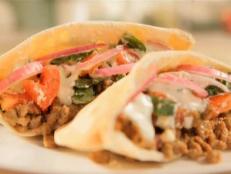 Cooking Channel serves up this Mediterranean Sausage Pitas with Tzatziki Sauce recipe  plus many other recipes at CookingChannelTV.com