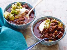 Cooking Channel serves up this Beef and Black Bean Chili with Toasted Cumin Crema and Avocado Relish recipe  plus many other recipes at CookingChannelTV.com