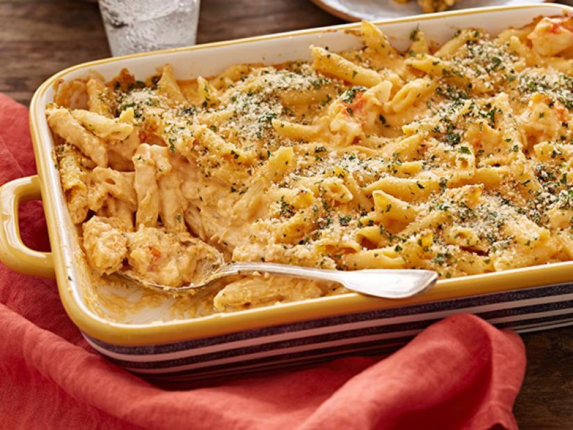 A casserole dish of lobster macaroni and cheese. This was made with lobster tails as well as a white sharp cheddar and gruyere mixture and other ingredients. It was topped with fresh parsley.