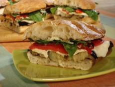Cooking Channel serves up this Grilled Eggplant and Fresh Mozzarella on Ciabatta with Roasted Red Peppers, Garlic Mayonnaise, Fresh Basil and Arugula recipe from Bobby Flay plus many other recipes at CookingChannelTV.com