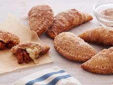 Cooking Channel serves up this Fried Apple Pies recipe from Bobby Flay plus many other recipes at CookingChannelTV.com