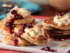 Cooking Channel serves up this Cinnamon Mascarpone Pancakes with Warm Morello Cherries and Hazelnuts recipe from Bobby Flay plus many other recipes at CookingChannelTV.com