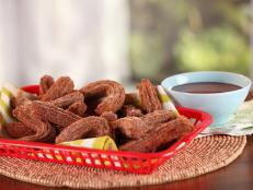 Cooking Channel serves up this Mini Pumpkin Churros Chocolate-Coffee Dipping Sauce recipe from Bobby Flay plus many other recipes at CookingChannelTV.com