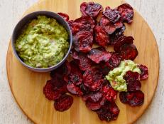 Cooking Channel serves up this Guacamole and Baked Beet Chips recipe from Debi Mazar and Gabriele Corcos plus many other recipes at CookingChannelTV.com